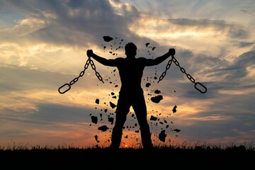 Silhouette of man breaking chains at sunset - symbol of human rights and liberation