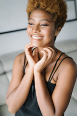 Woman touching her face with the hands. In love happy eyes. Vertical composition happy female...