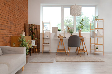 Interior of modern office with workplace, shelf units and window