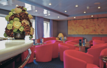 Bar lounge or club onboard classic historic cruiseship cruise ship liner in dated ambience and...