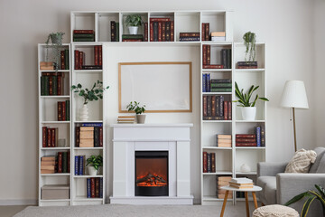 Interior of modern home library with bookshelves, sofa, coffee table and fireplace