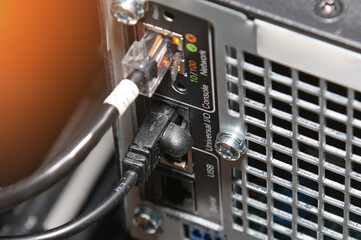 Fototapeta premium Connection of the signal transmission module in the telecommunication rack.Sunflare. 