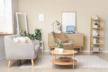 Interior of living room with sofa, armchair and commode