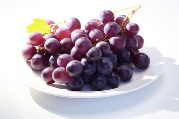 Fototapeta premium A single bunch of dark purple grapes resting on a white plate, with soft natural light illuminating the glossy surface and creating a shadow effect, enhancing their appeal.