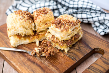 A slice of bread filled and topped with a smooth, rich nut nougat cream. The creamy filling and topping add a delightful, indulgent touch to the bread, creating a tempting treat