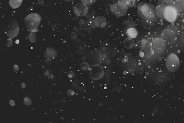 Mostly black background with a few bokeh lights - minimal - photo-realistic.