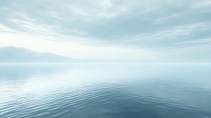 Fototapeta premium A tranquil seascape with a cloudy sky and calm blue water.
