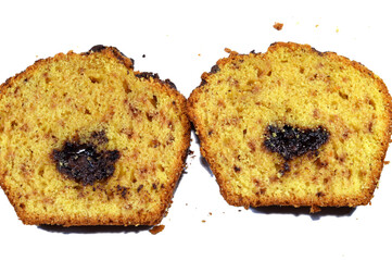 Orange cake filled with chocolate paste spread and topped with chocolate chips and chunks, usually taken with tea, sponge cake with orange fruit flavor baked in the oven, selective focus