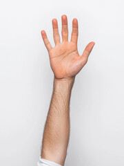 hand raised in snap out gesture against plain background, showcasing relaxed and open expression. This captures moment of communication and engagement