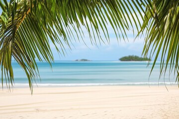 Obraz premium Tropical beach background with palm leaves, sandy shore, and blurred island in the distance.