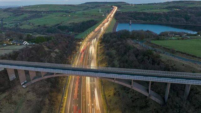 Aerial hyper-lapse video of Scammonden bridge in Kirklees, west Yorkshire early evening showing the traffic and the countryside landscape. 