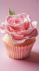 Cupcake with pink rose frosting on pastel pink background, dessert art concept