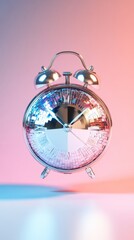 Silver alarm clock with disco ball face on colorful gradient background. Time and creativity concept