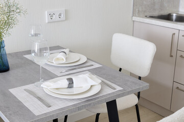 A Modern Dining Space Featuring an Elegant Table Setting to Enhance Your Experience