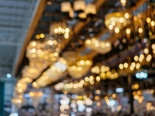 Blurred, lamp shop with bokeh  background. lamp hanging under the ceiling.