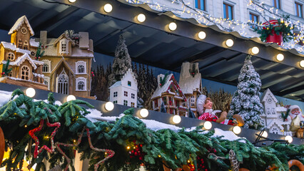 Fototapeta premium Festive decoration on the eve of the Christmas holidays. Christmas holidays and a good mood thanks to the festive decoration. Festive lighting during the holidays.