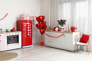 Interior of festive kitchen with heart-shaped balloons, wine, gift boxes and hearts. Valentine's...