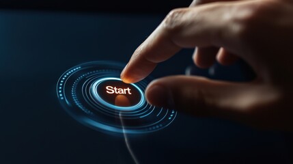A hand is pressing a start button on a device