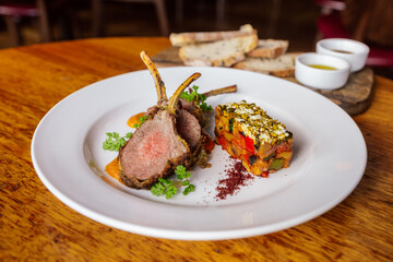 Gourmet Rack of Lamb with Colorful Ratatouille and Herb Garnish