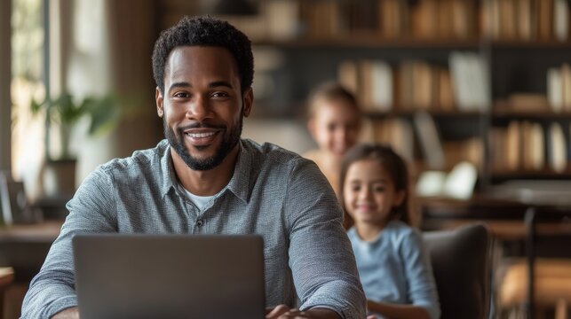 Happy father working from home with his children