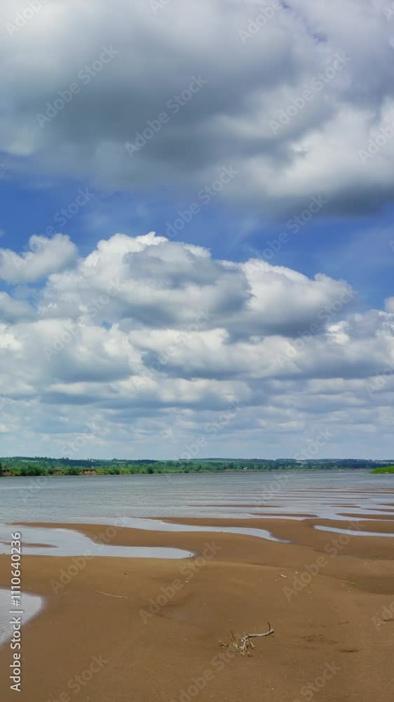 Wall mural clouds over river landscape, timelapse. vertical video