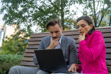 Team work process. Photo thoughtful business crew working with new startup project laptop. Project managers meeting. Analyze plans, papers. 