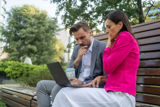 Team work process. Photo thoughtful business crew working with new startup project laptop. Project managers meeting. Analyze plans, papers. 