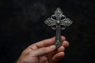 Catholic Cross in Male Hand with Black Background
