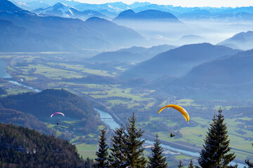 Paragliding. Flight over the Inn Valley and the Kitzbühel Alps (Tyrol, Austria) in early winter....