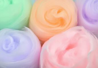 Soft pastel cotton candy-inspired textures in hues of pink, blue, and purple form a vibrant, fluffy background. Great for whimsical designs, summer decorations, and light-hearted projects.