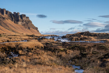 Mountain and waterfall Fossalar, south Iceland