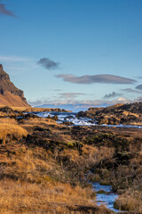 Mountain and waterfall Fossalar, south Iceland