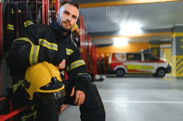 fireman sitting on bench at fire station