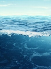 Fototapeta premium Calm ocean surface with gently lapping waves in shades of blue and white, creating a serene and dynamic background for underwater scenes.