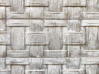 Textured concrete wall displaying a woven pattern ideal for design and presentation purposes