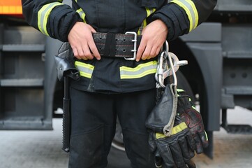 Details with the carabiner and harness of a firefighter