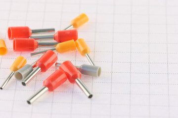 Copper pin colored insulated tips. Close-up. Soft focus.