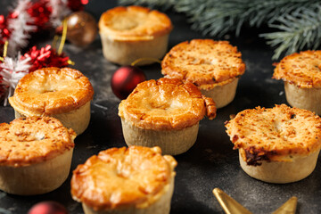 Christmas steak mini pie with decoration, gifts, green tree branch