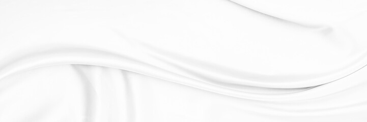 White gray satin texture that is white silver fabric silk panorama background with beautiful soft blur pattern natural.