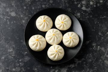 Steamed Teriyaki chicken and vegetable bao buns served with Asian style salad