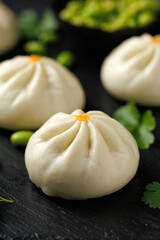 Steamed Teriyaki chicken and vegetable bao buns served with Asian style salad