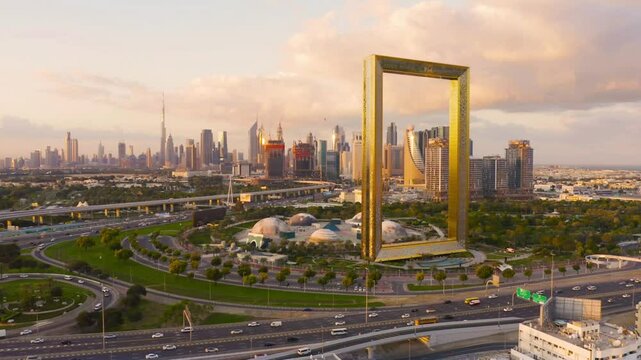 Aerial view of the Dubai Frame with the downtown skyline in the background, showcasing the iconic landmark and the city's modern architectural beauty. A stunning perspective of Dubai's landscape