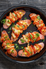 hot sausages baked with cheese, tomato, mustard