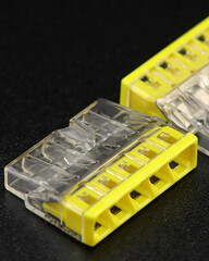 Terminals for quick connection of copper electrical wires. Close-up. Soft focus.