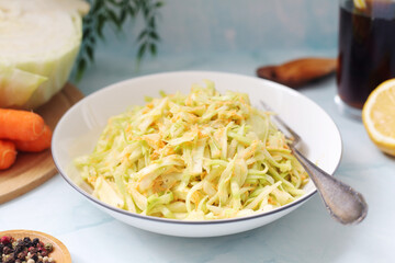 A bowl with coleslow salad