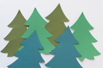 blank flat machine-cut paper tree shapes on blank paper