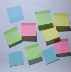 colorful paper, stick on white wall. business concept