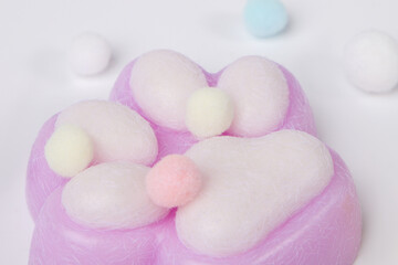 Pink toy cat paw close up view. Decompression squeeze toy.