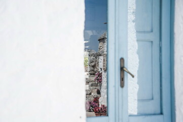 blue door in the wall with reflections 