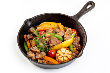 meat stew with mixed vegetables in a hot plate isolated on white background.